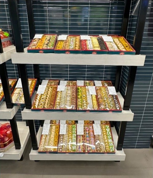 Sweets arranged on shelving racks